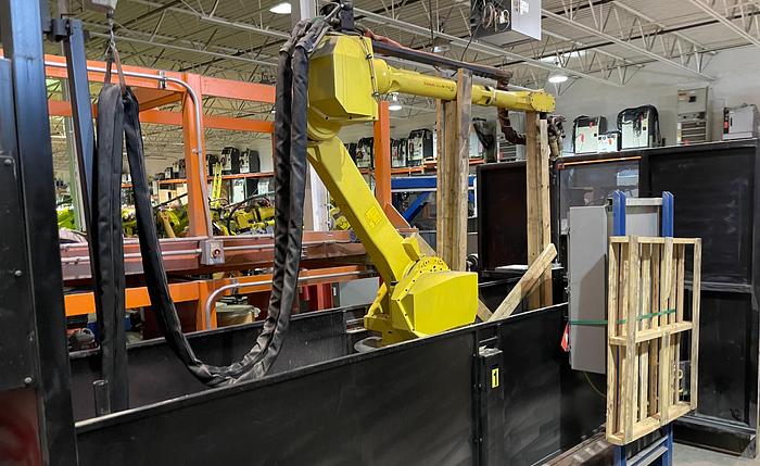 LINCOLN SYSTEM 55 WITH FANUC M710iC/20L TORCH CUTTING CELL WITH DUAL ROLL IN ROLL OUT TABLES